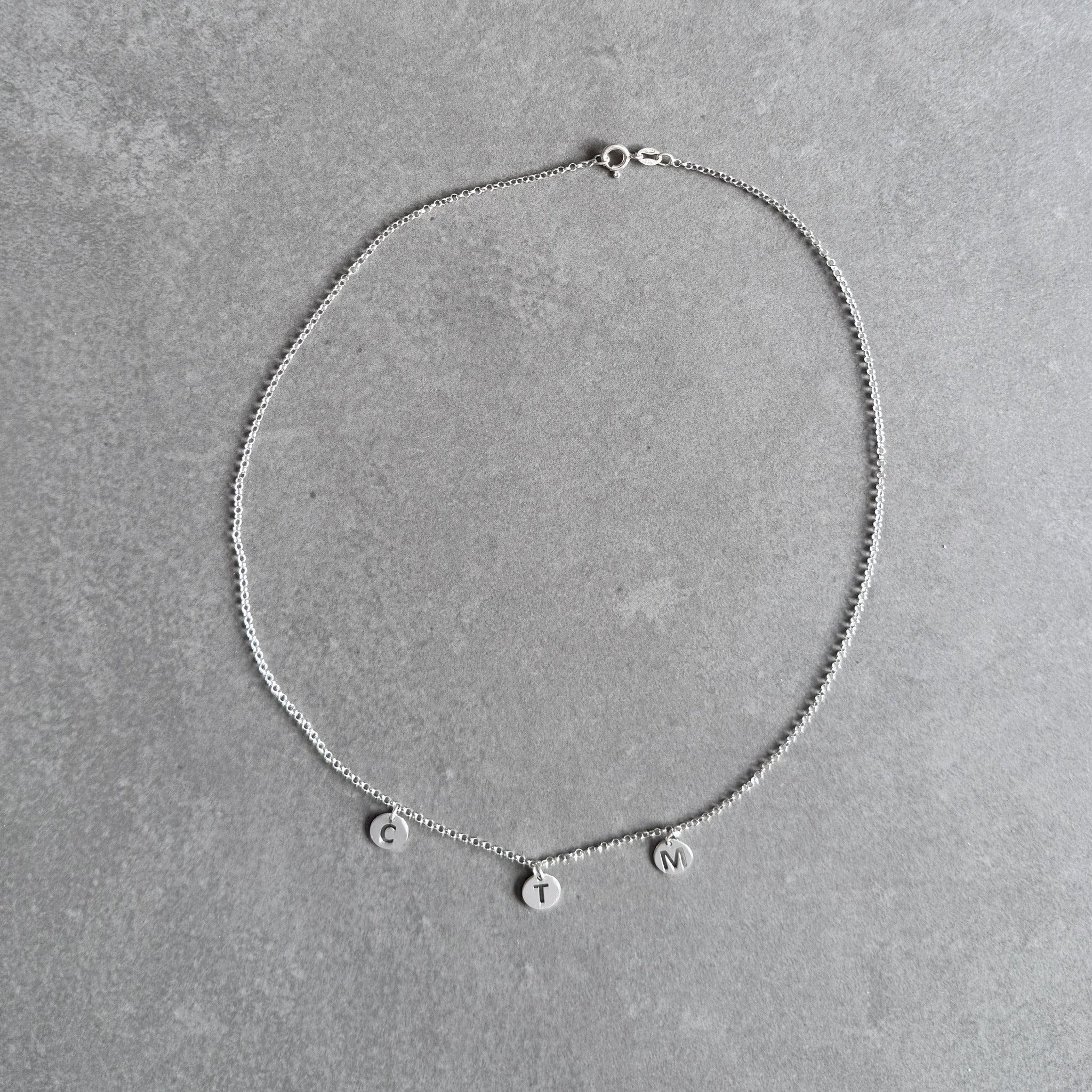 Family initial necklace in sterling silver by By Wue
