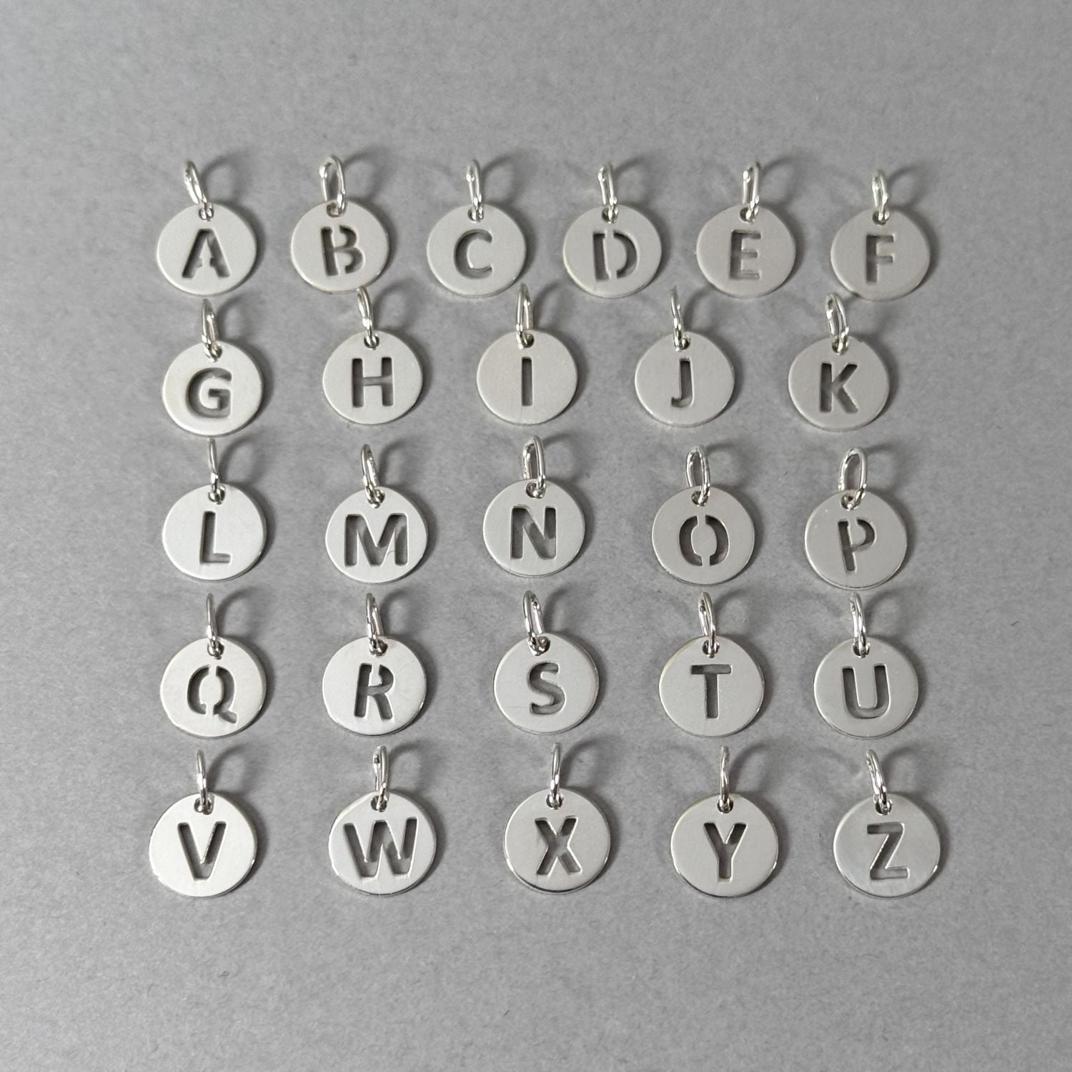 By Wue sterling silver initial charms, A to Z