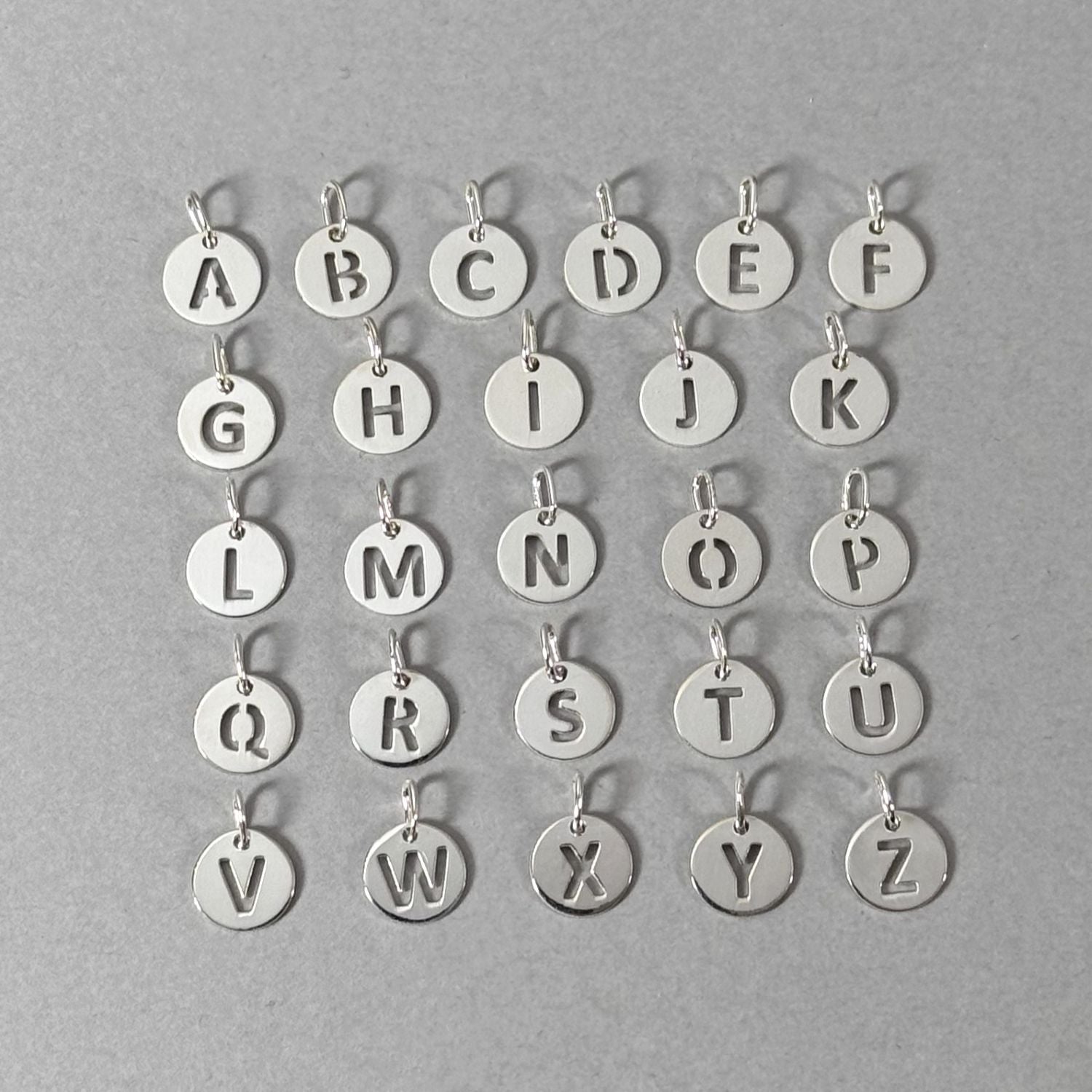 By Wue sterling silver initial charms, A to Z