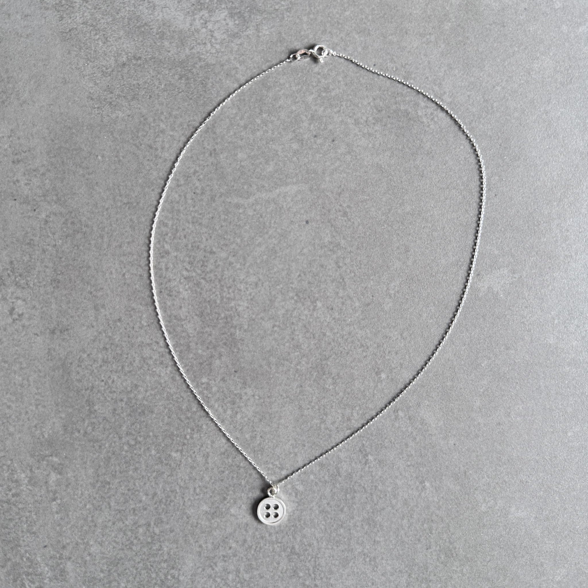 Button pendant necklace in sterling silver by By Wue