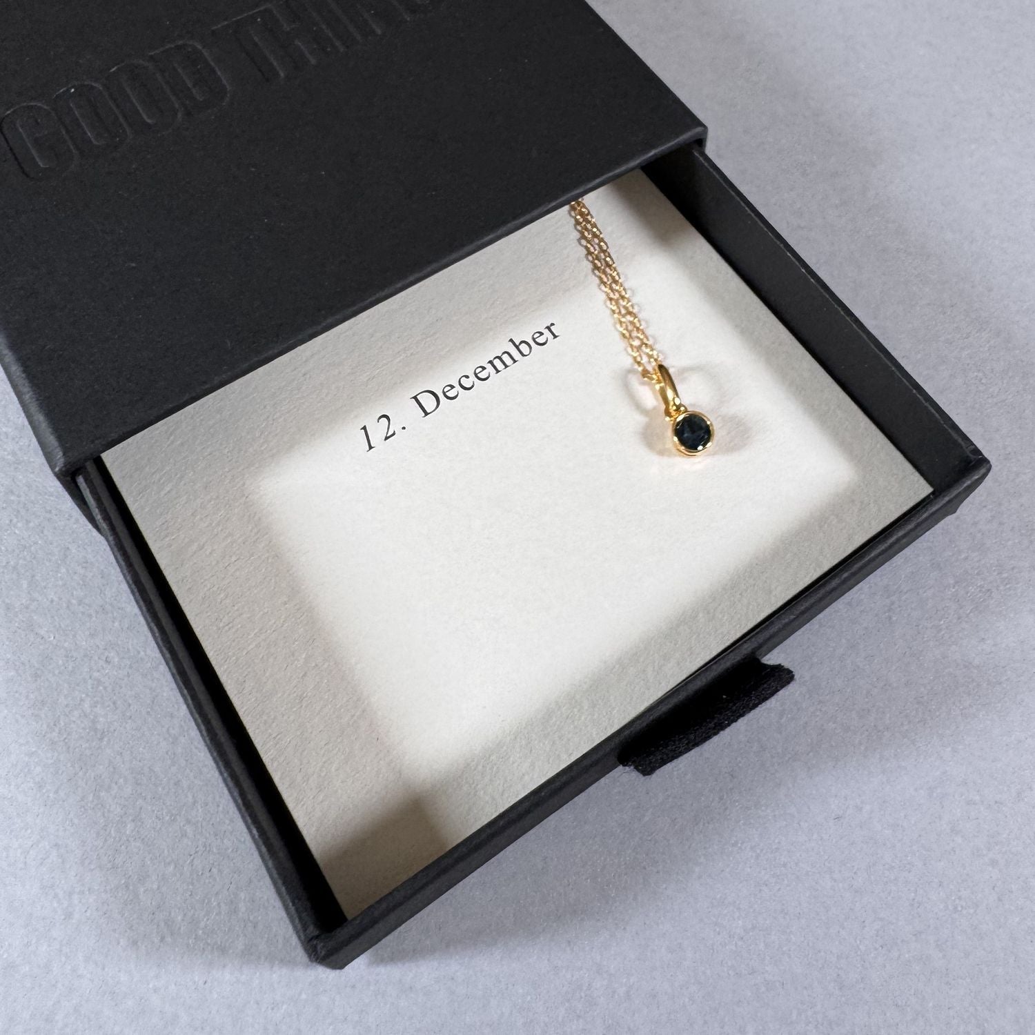 December birthstone necklace in a By Wue gift box with month card
