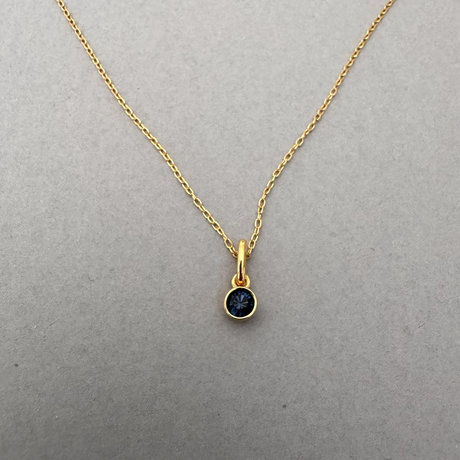 December birthstone necklace set with blue zircon, 24ct gold plated sterling silver