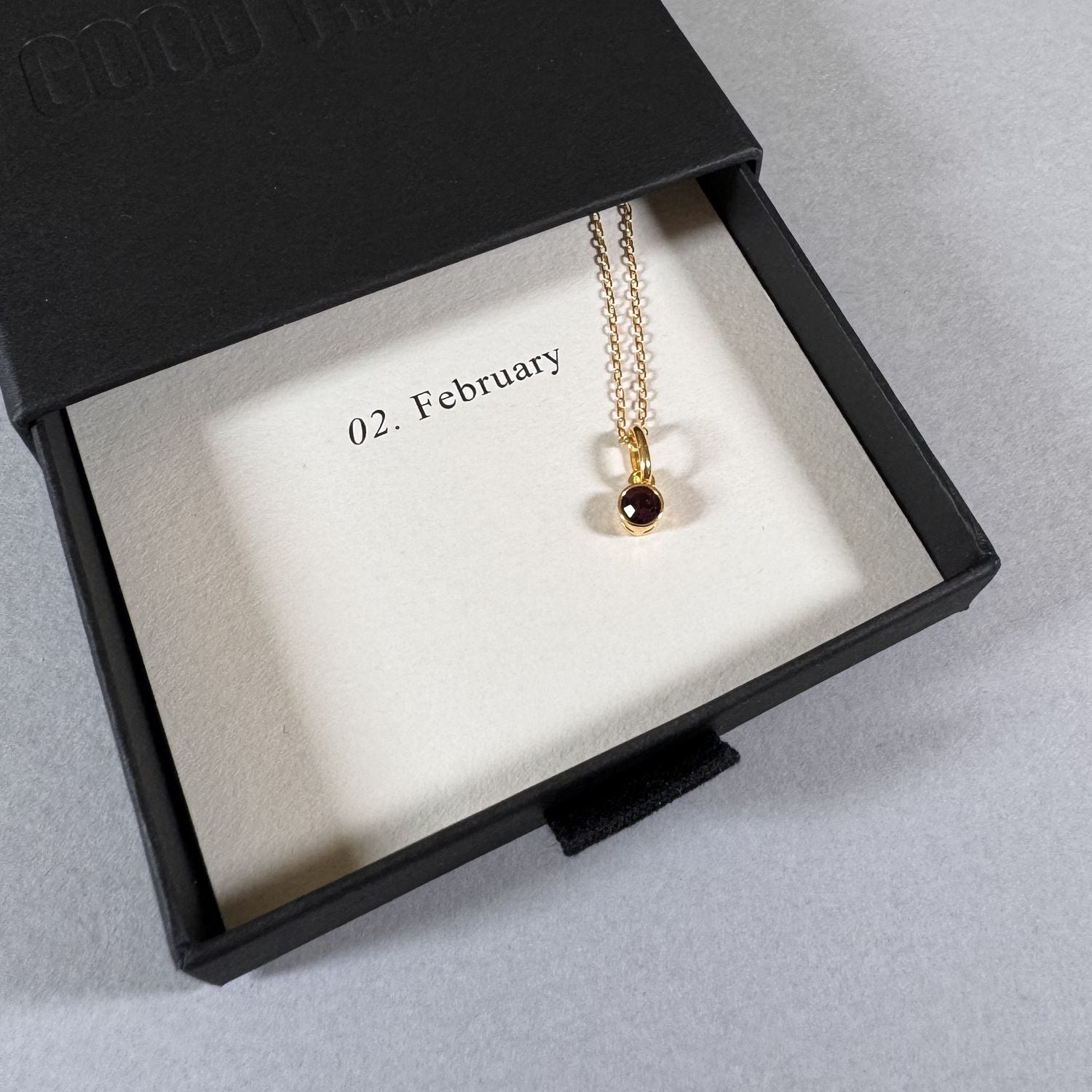 February birthstone necklace in a By Wue gift box with month card