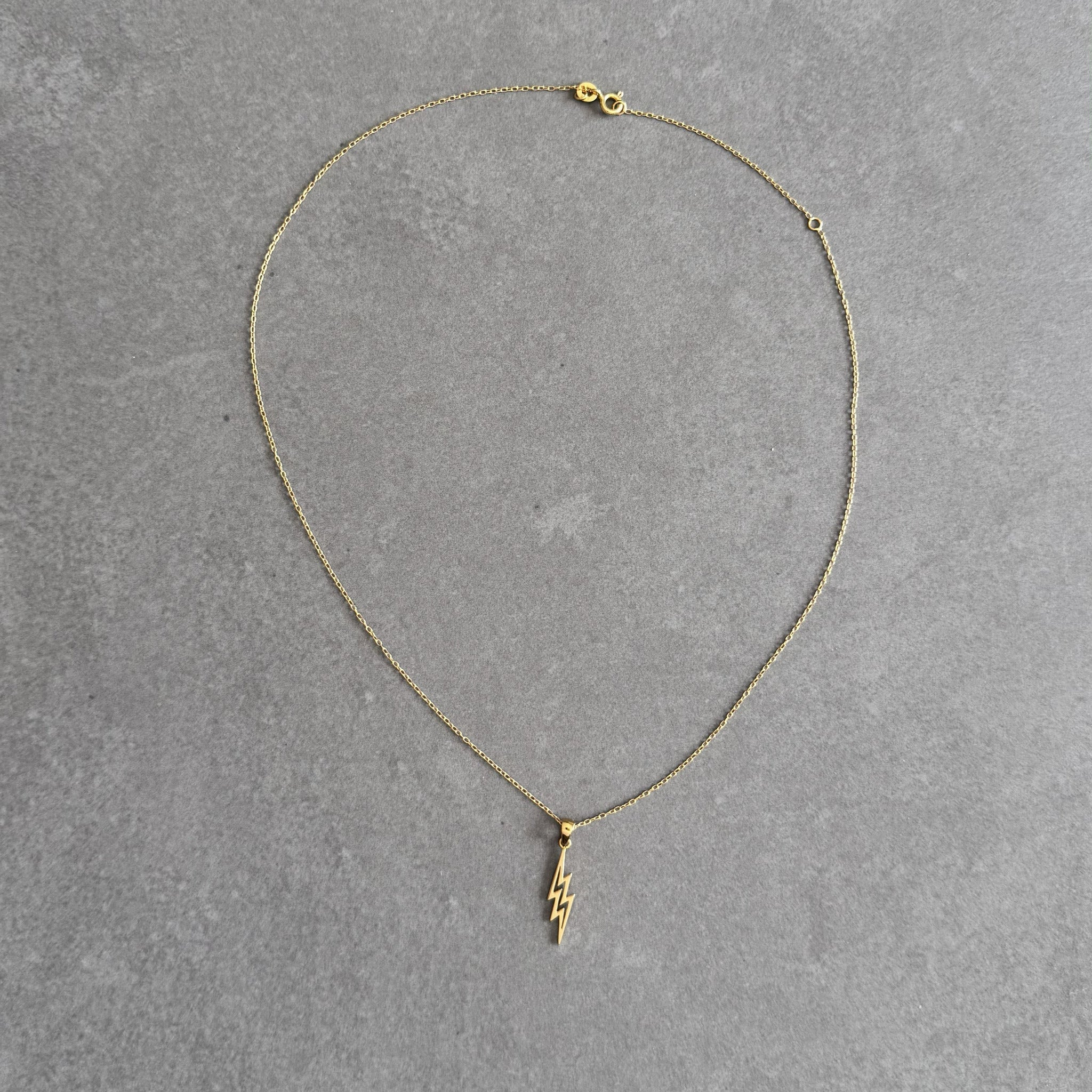 Gold plated lightning bolt pendant necklace by By Wue