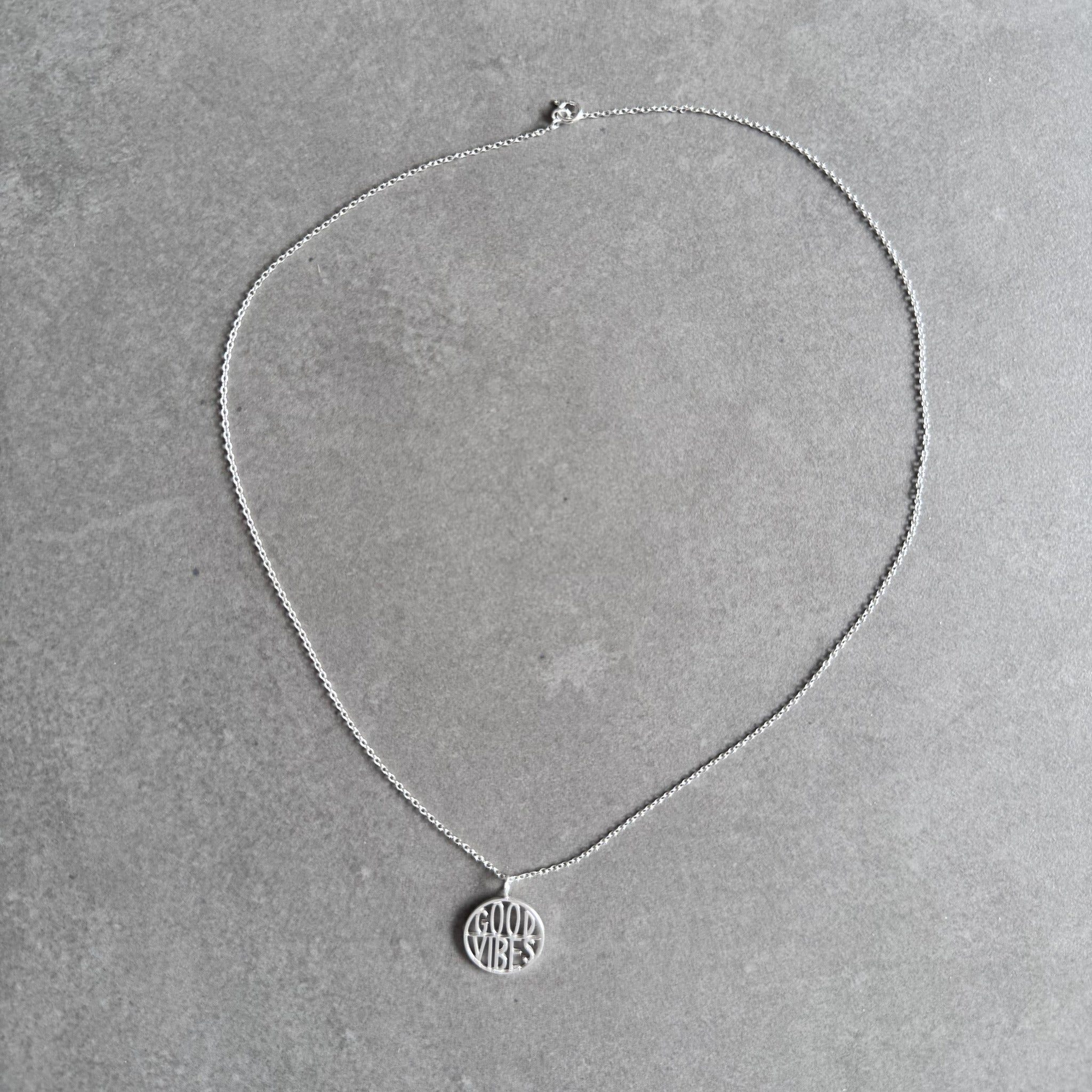 Good Vibes pendant necklace in sterling silver by By Wue