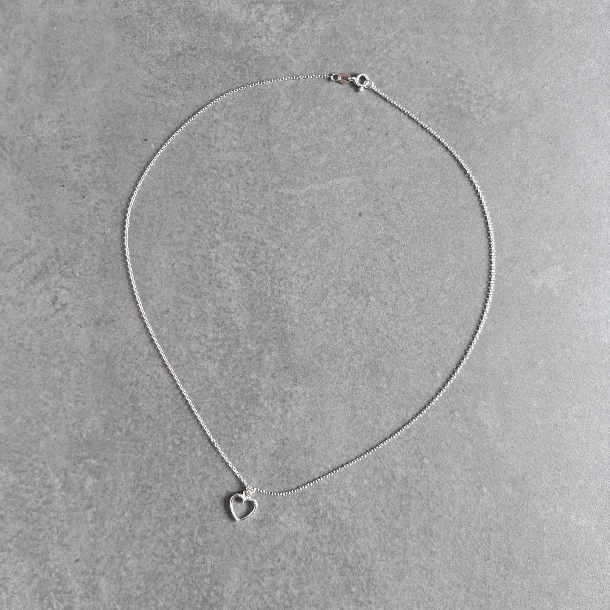 Heart pendant necklace in sterling silver by By Wue