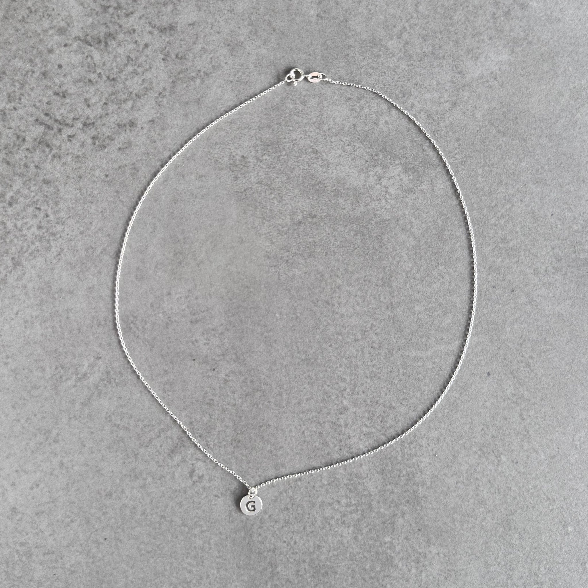 Initial necklace in sterling silver by By Wue