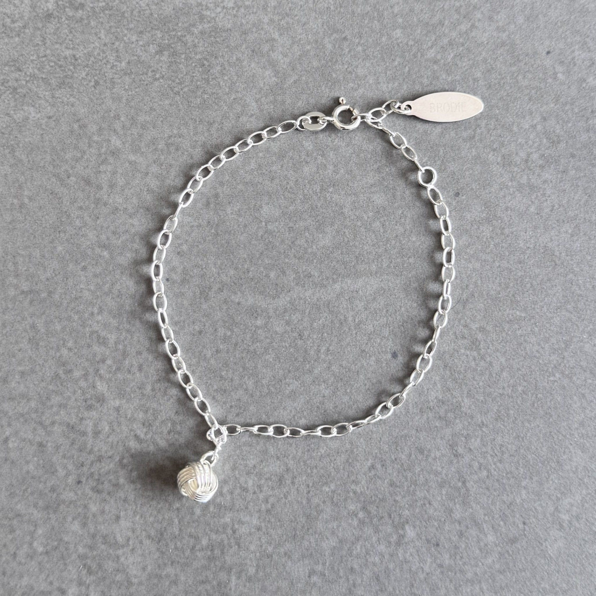 Bridesmaid knot charm bracelet in sterling silver by By Wue