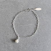 Knot charm bracelet in sterling silver by By Wue