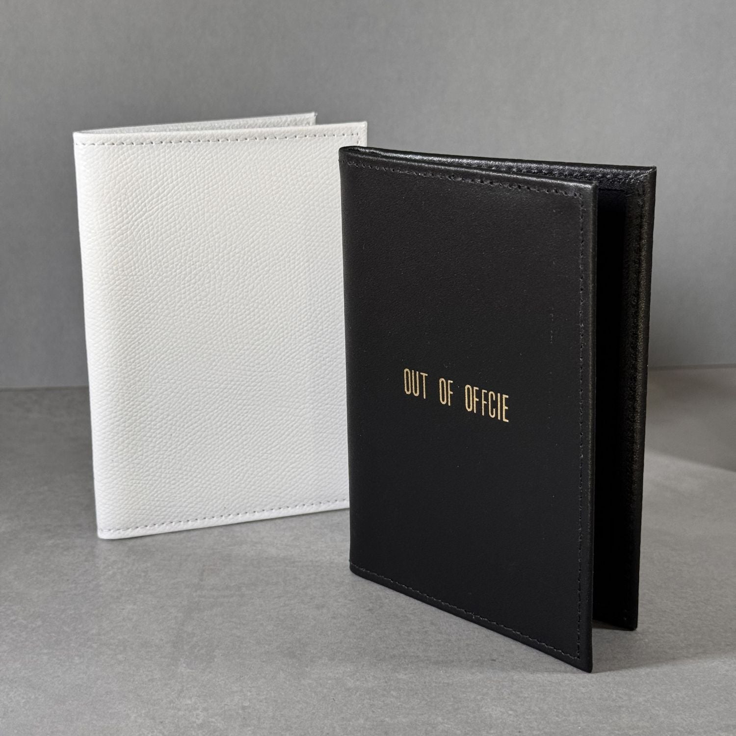 Personalised passport holders in white and black leather, gold embossed